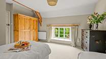 The outlook from this bedroom is of the near end of the farmhouse as you approach down the lane.