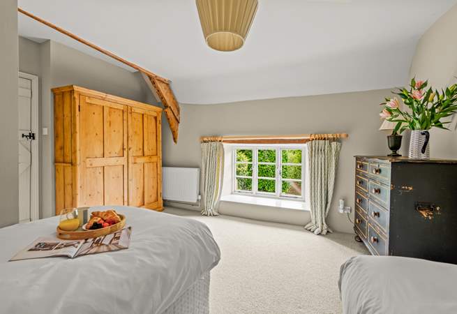 The outlook from this bedroom is at the near end of the farmhouse as you approach down the lane.
