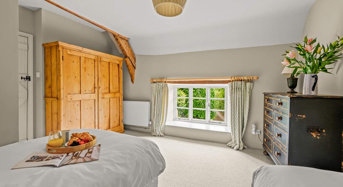 The outlook from this bedroom is at the near end of the farmhouse as you approach down the lane.