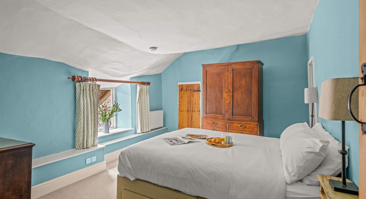 This double bedroom has access to the landing with the family bathroom as well as to the shower-room on the other side. The ceiling is part of the amazing character of this farmhouse!