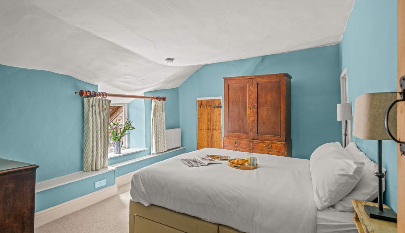 This double bedroom has access to the landing with the family bathroom as well as to the shower-room on the other side. The ceiling is part of the amazing character of this farmhouse!
