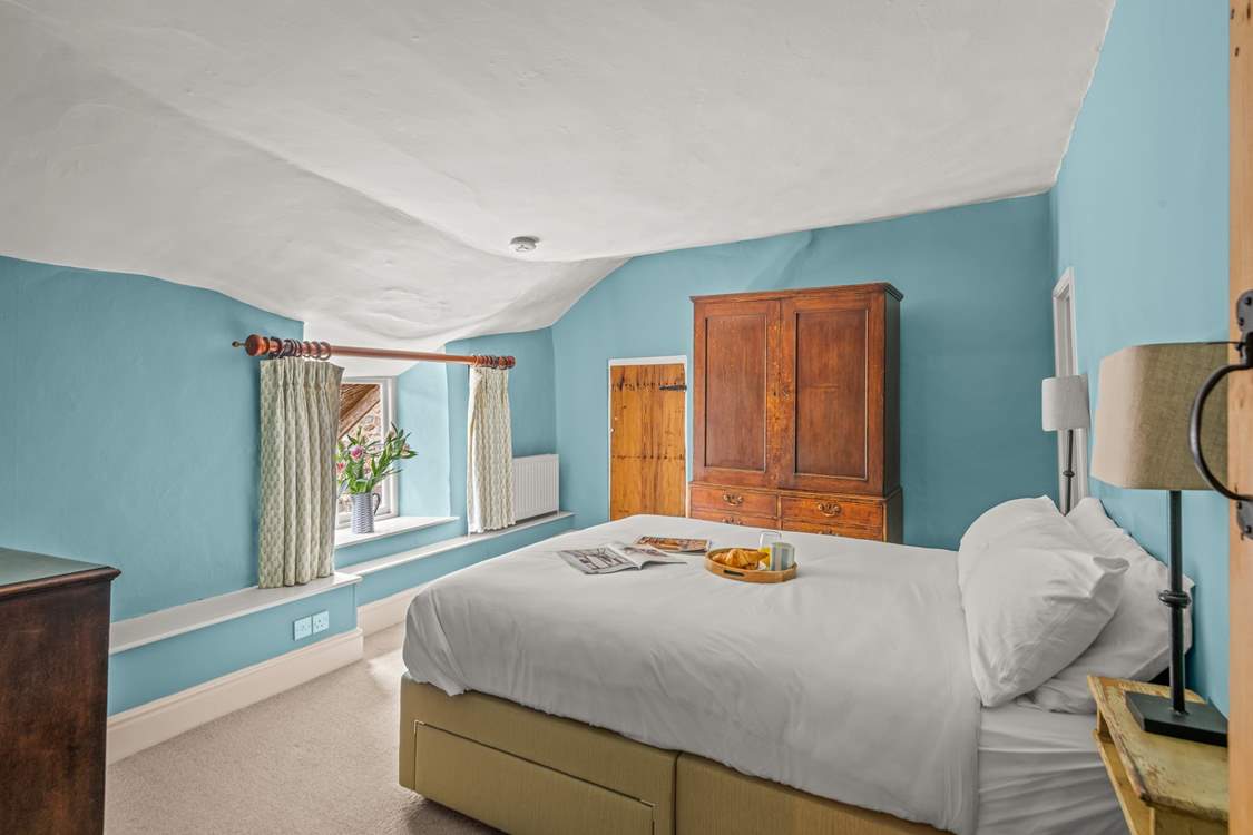 This double bedroom has access to the landing with the family bathroom as well as to the shower-room on the other side. The ceiling is part of the amazing character of this farmhouse!