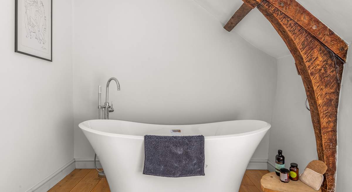 The very stylish family bathroom (the bath is up one step from the rest of the bathroom) is a brand new addition to the farmhouse.