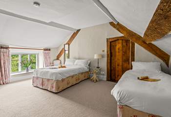 Linked by a door to the master bedroom is this family room with a double and a single bed. This room also has separate access from the central staircase.