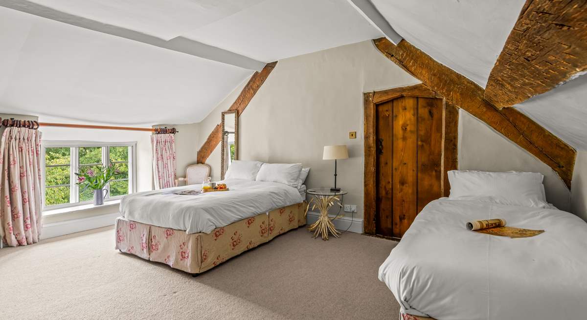 Linked by a door to the master bedroom is this family room with a double and a single bed. This room also has separate access from the central staircase.