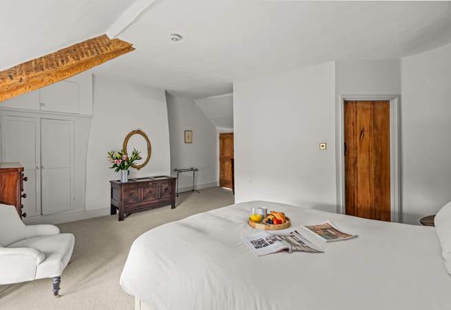 There are some lovely pieces of antique furniture that add to the character of this happy family holiday home.