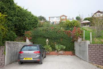 At the bottom of the garden is private parking for two cars.