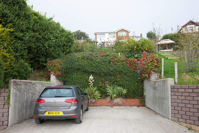 At the bottom of the garden is private parking for two cars.