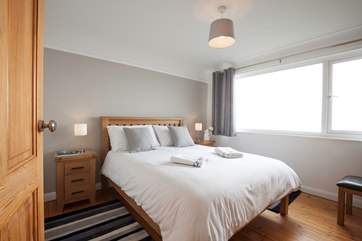The master bedroom with king-size bed and lovely sea views.