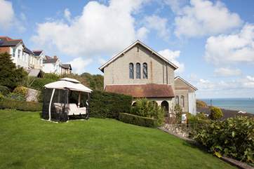 Take a seat in the garden and look out across the English Channel and watch the boats sail by.