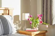 The afternoon sun glows in to the bedroom.  Why not bask in the warmth with a good  book.