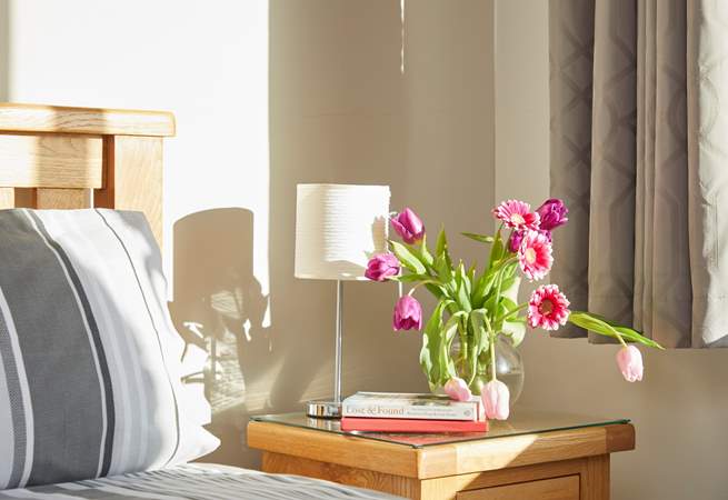 The afternoon sun glows in to the bedroom.  Why not bask in the warmth with a good  book.