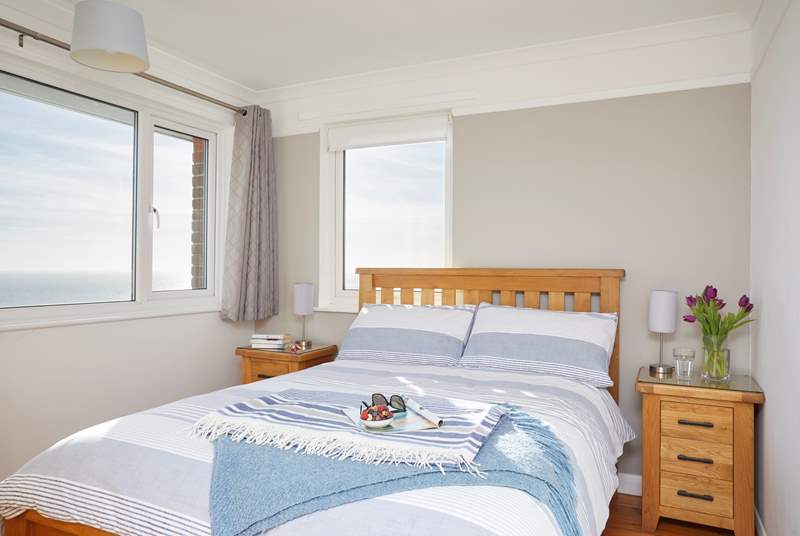 The main bedroom on the first floor has sea views through both windows.