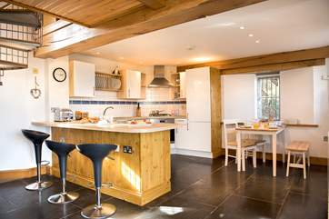 The kitchen and dining-areas sit at one end of the open plan living-room.