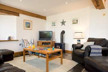 The gas wood-burner effect stove makes this a perfect retreat all year round.
