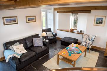 The open plan living-room is light and airy and the large windows take full advantage of the views.
