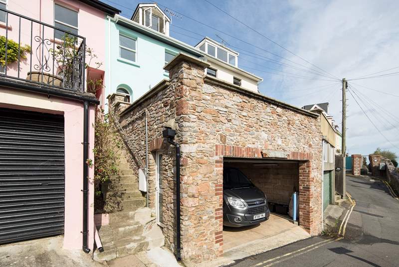 Double garage. The car pictured in the garage is a people carrier style vehicle. However less confident drivers may wish to use the garage for just the one car.
