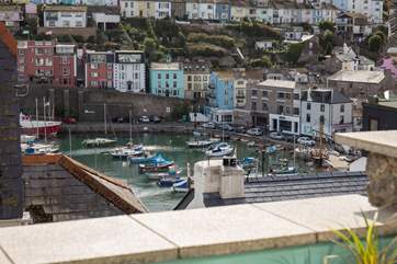 You could almost reach out and touch the harbour from your enclosed terrace.