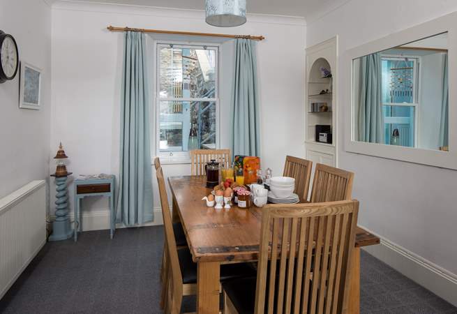 The dining-area boasts a family size dining-table. Perfect for serving up a feast.