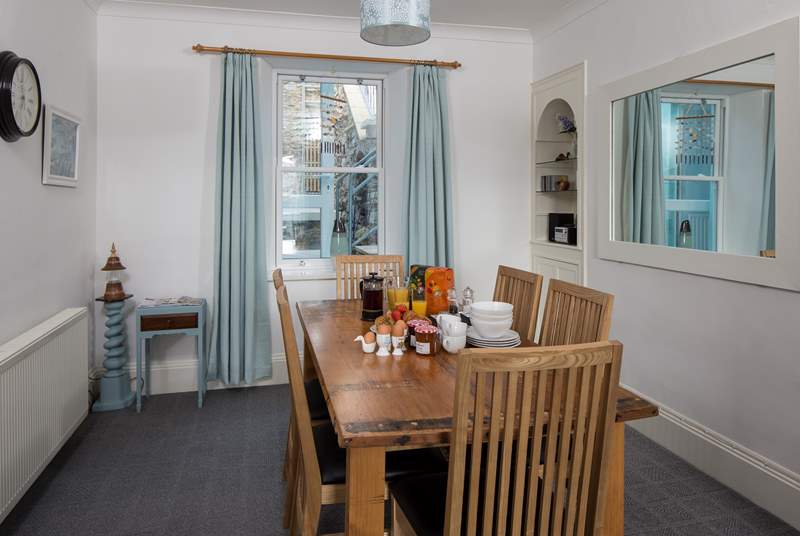 The dining-area boasts a family size dining-table. Perfect for serving up a feast.