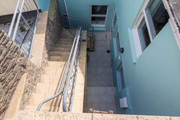 Steps down from the garden-area to the kitchen door.