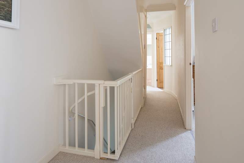 First floor hallway, clever baby gate ensures little ones can't find their way down the stairs to the ground floor, however be aware that there is another flight of stairs to the second floor.