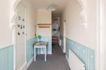 This bright and welcoming entrance hall awaits your arrival.