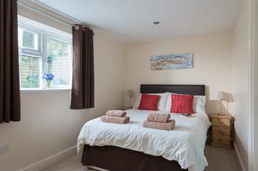The bedroom is at the rear of the cottage.