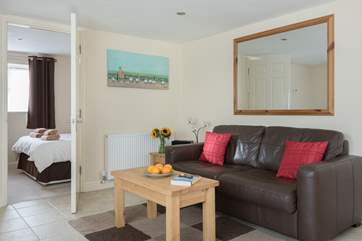 The open plan living-room is a relaxing space to return to after a day out exploring.