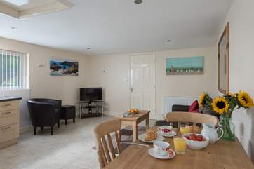 This well-designed cottage has the bedroom to the rear just through that door.