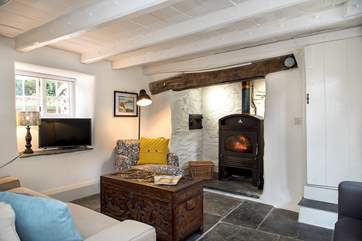 The supersize wood-burner makes the sitting-room warm and cosy all year round.