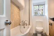 The downstairs bathroom - please note the bath is not full size.