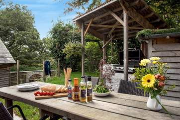 The garden at the back is perfect for al fresco dining, complete with a covered barbecue-area and butlers sink!