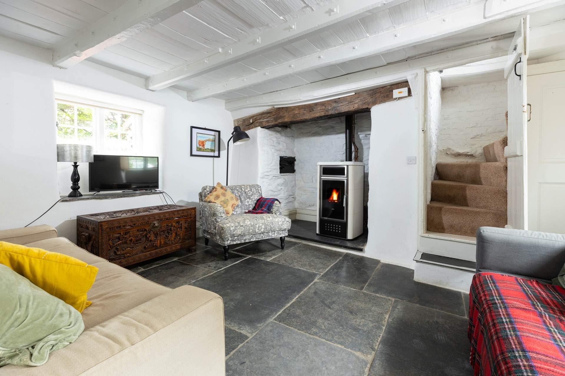 Steep twisting original stairs lead up to the bedrooms.