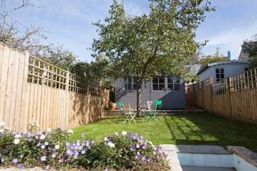 The delightful rear garden capturing the summer sunshine.