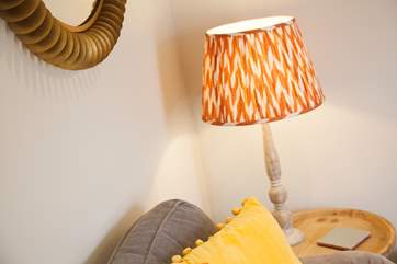 Under the soft lighting at night, cosy up with a blanket on the sofa and read your favourite novel.