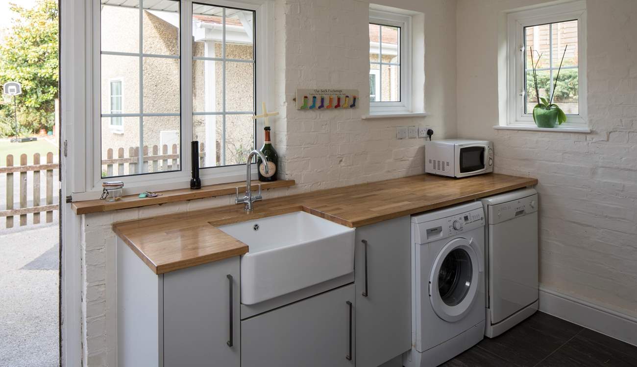 This useful utility and boot-room has stacks of space for coats, shoes and muddy dogs.