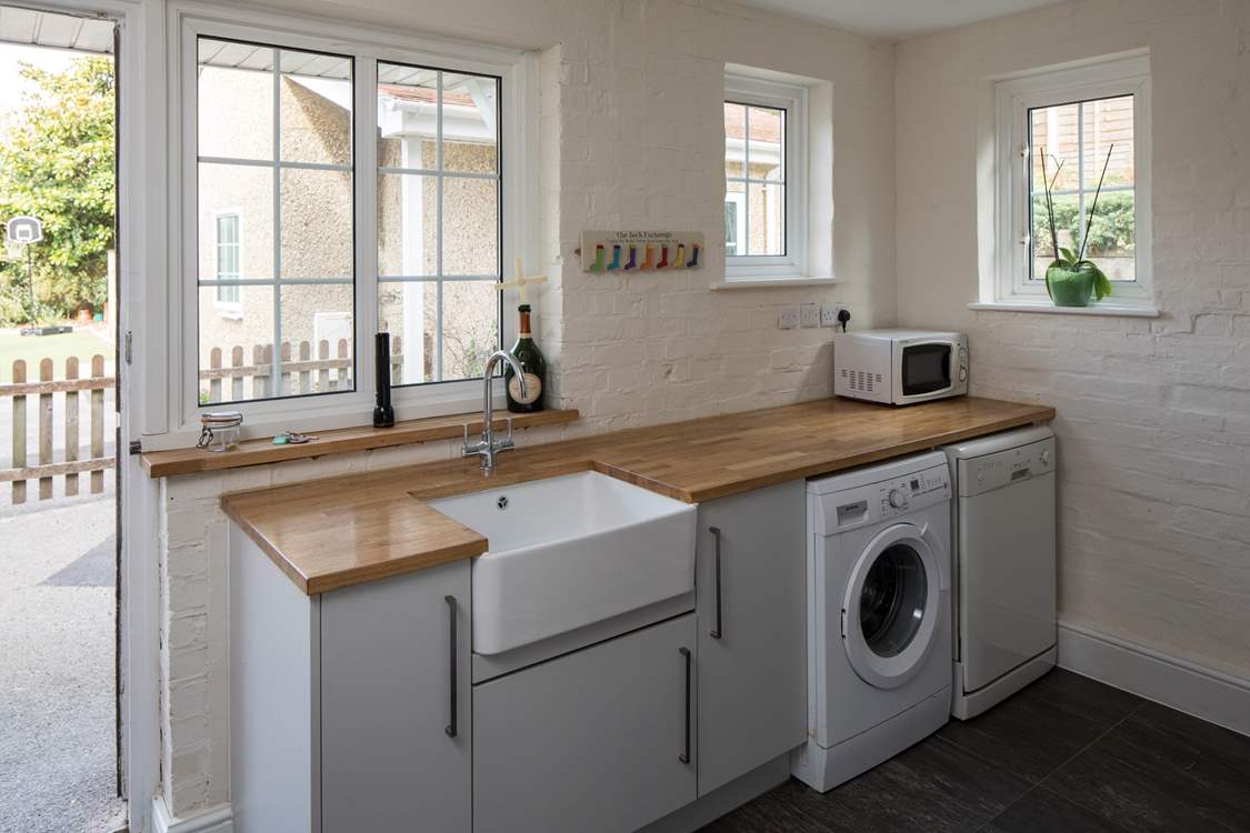 This useful utility and boot-room has stacks of space for coats, shoes and muddy dogs.