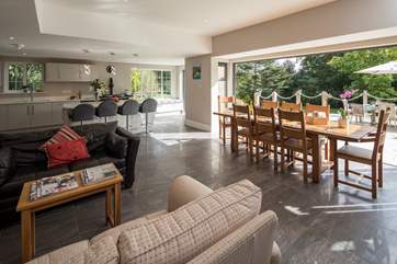 This spacious family home has a fabulous open plan space, with tri-fold doors onto the terrace.