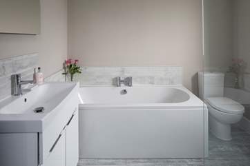 The en suite has a large shower cubicle with drench head.
