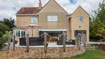 This fabulous terrace and the folding doors create a wonderful space, with super comfy garden furniture.
