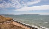 Looking east towards the Isle of Wight and the Needles, dogs are allowed on the beach all year. - Thumbnail Image