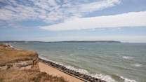 Looking east towards the Isle of Wight and the Needles, dogs are allowed on the beach all year.