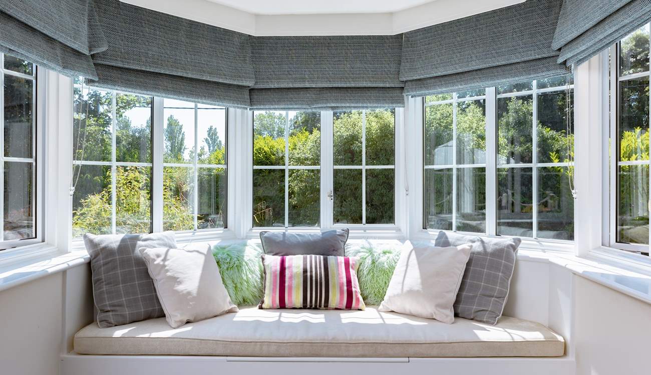 Take a moment to curl up in the sitting-room window seat.