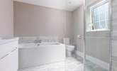 The en suite to Bedroom 5 has a large shower cubicle with drench head. - Thumbnail Image