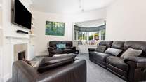 The cosy sitting-room with ornamental fireplace.