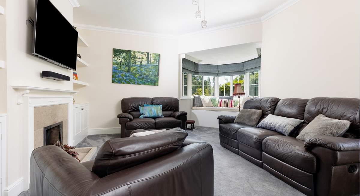 The cosy sitting-room with ornamental fireplace.