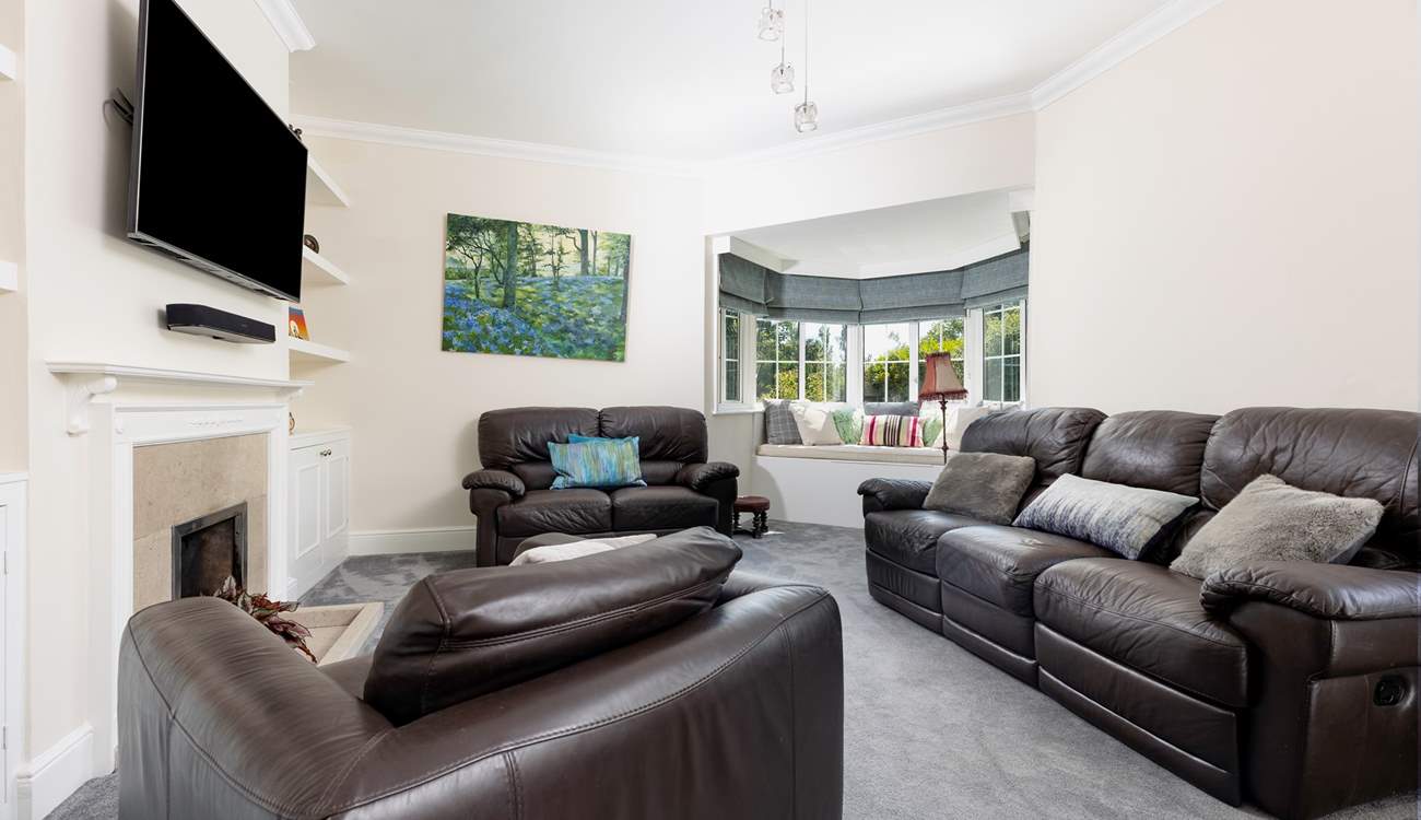 The cosy sitting-room with ornamental fireplace.