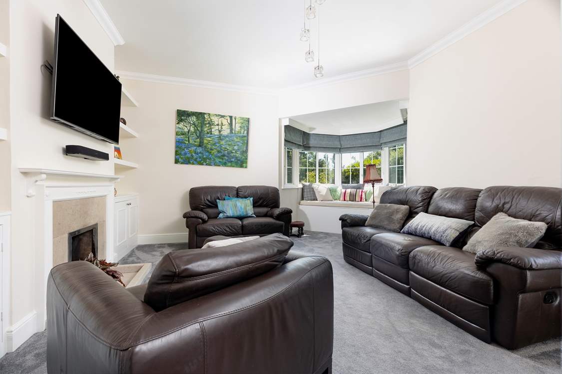 The cosy sitting-room with ornamental fireplace.