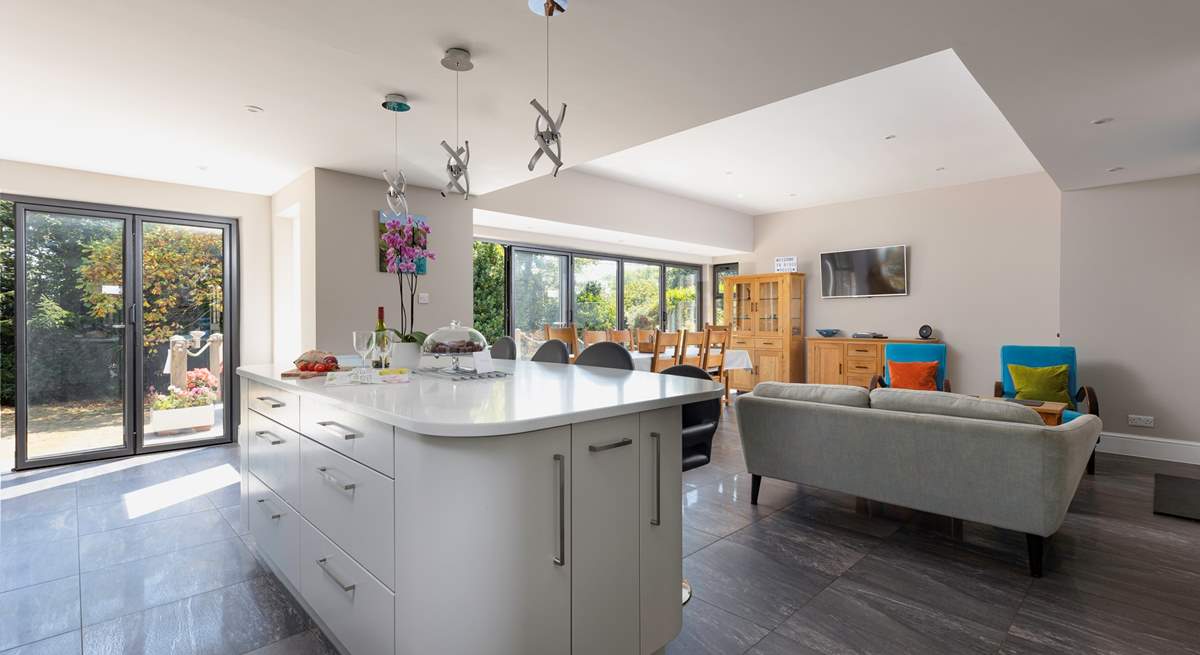 This spacious family home has a fabulous open plan space, with tri-fold doors onto the terrace.